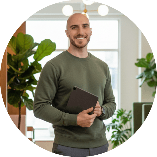 Feelpath founder standing in a calm, plant-filled workspace